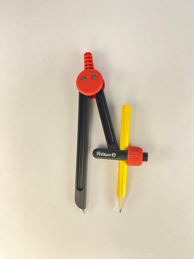 Est/ 1 compás plástico rojo